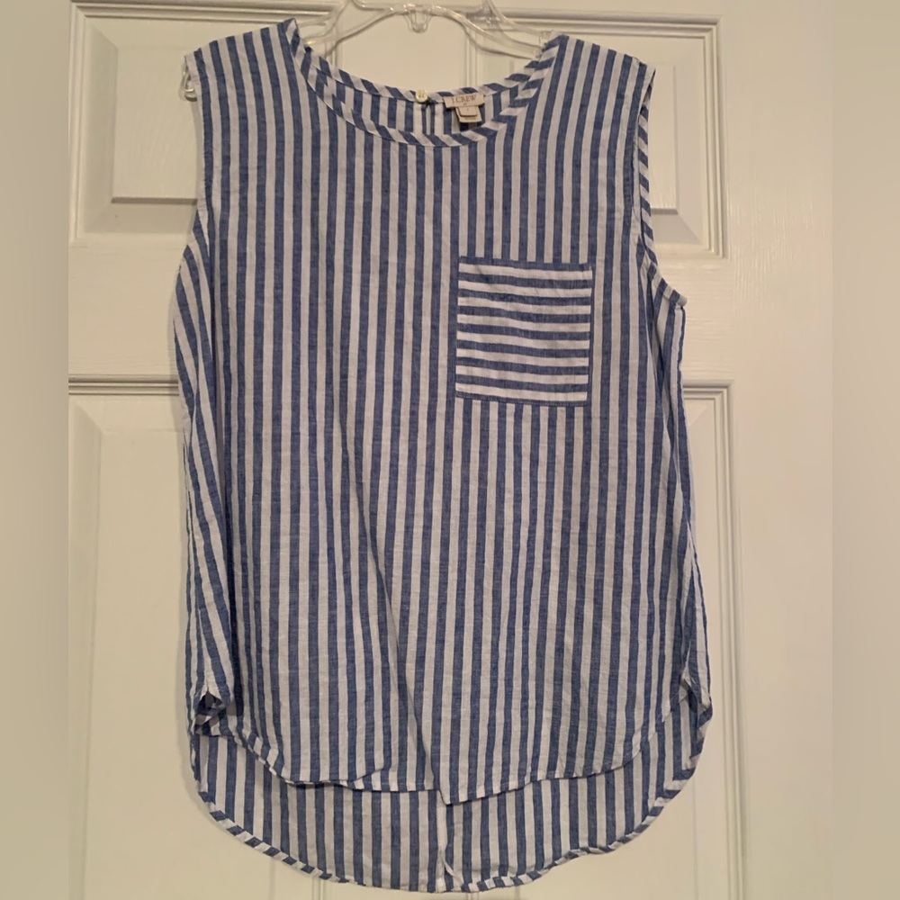 Sleeveless blue and white striped shirt
